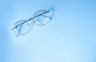 glasses for vision on a bright background, eye protection and health