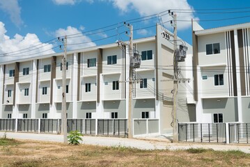 New apartment building three floor for sale in sunny day blue sky background. Real estate property, banking and construction industry concept.