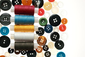 Multicolored threads and buttons for clothes.