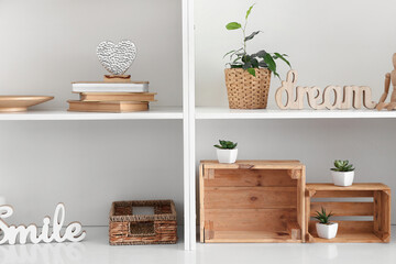 Shelf unit with beautiful decor in room