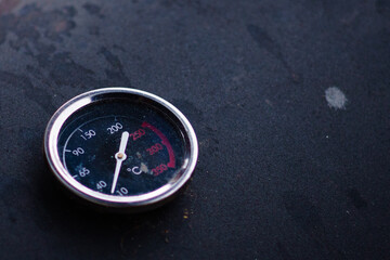 Closeup of a temperature gauge barbecue tool