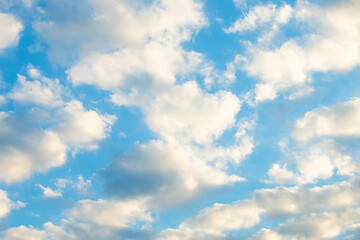 many beautiful white clouds in the sky.