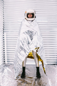 Black astronaut wrapped in emergence blanket