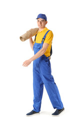 Male worker with rolled carpet on white background