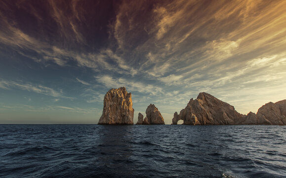 Beautiful view of the Arch of Cabo San Lucas under the cloudy sunny sky