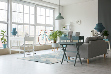 Interior of light modern office with big window