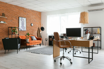 Workplace with modern computer in light office interior