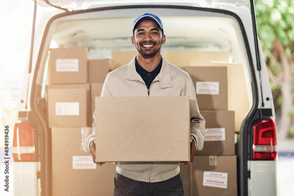 Aufkleber stopping off for another delivery. portrait of a delivery man unloading boxes from his van.