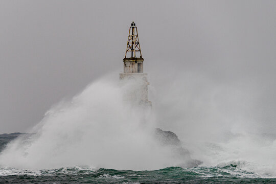 Big storm near an old lighthouse in Achtopol bay, Black sea, Bulgaria