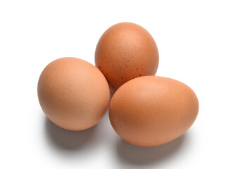 Brown eggs on white background