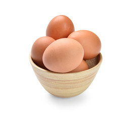 Bowl with brown eggs on white background