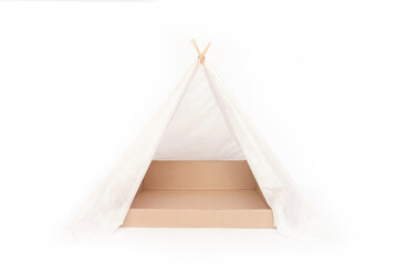 Homemade hut with a box. Teepee for a cat with a paper box on a white background is isolated. © OlgaBartashevich