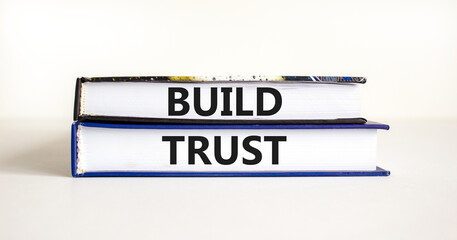 Build trust symbol. Concept words Build trust on books on a beautiful white table white background....
