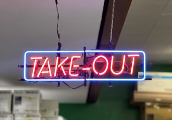 restaurant neon take-out sign at the to go counter