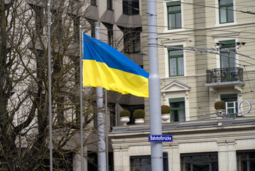 Waving flag of Ukraine as solidarity act against the Russian invasion waving from Bahnhof Bridge on...