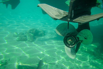 Underwater shot of a boat's engine propellers © Raphael Koch/Wirestock Creators