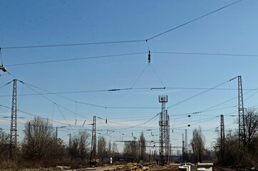 Obraz premium Railway facilities and electrical network with iron poles and wires of the old station Poduyane, built in 1930 now under renovation, Sofia, Bulgaria 