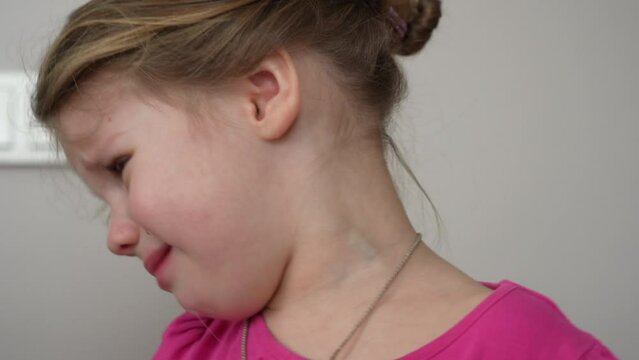 Little angry caucasian kid. Furious capricious toddler kid got upset and sad. Stubborn child bad attitude. Depressed little girl complaining with mom.