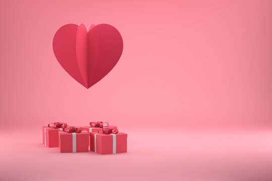 Gift Boxes And An Oversized Red Heart On A Pastel Pink  For Valentines Day