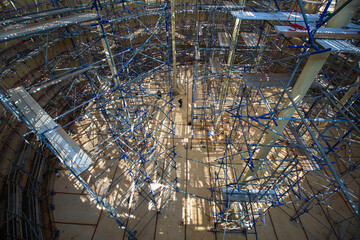 Top view Worker male assembly in progress storage tank oil inspection scaffolding work at high