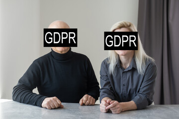 GDPR (general data protection regulation) concept. Businessman or IT technologist with text GDPR and icons of people