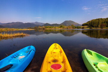 Tha Khoei reservoir in Ratchaburi, Thailand. Beautiful landscape of lake and range of mountain with...