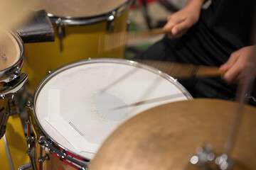 Drum set with drumstic on stage.Musician playing drum during a live performance.