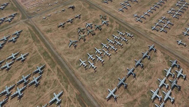 Aerial bird view of aircraft boneyard or graveyard is storage area for airplanes that are retired from service they are generally located in deserts for example in Tucson USA 4k high res animation