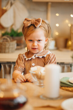 Upset Pretty Little Girl At The Kitchen Table. Poor Appetite In Kids. 