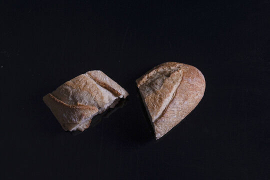 Shot Of Two Pieces Of Bread On Black Isolated Background