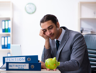 Young male accountant working in the office