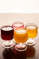 Different liquors in pub. Friends having alcoholic drinks in the bar