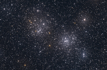Beautiful space background with stars glowing in the darkness.