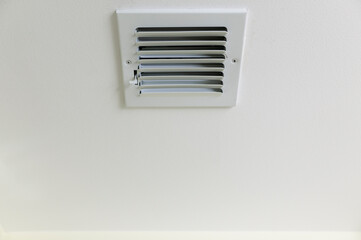 Air conditioning vent on a ceiling