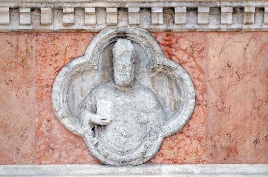 Saint Ambrose by Giovanni di Riguzzo relief on facade of the San Petronio Basilica in Bologna, Italy