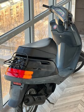 Photo of a black scooter. Black Bike