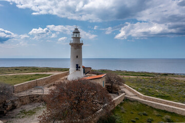 Fototapeta na wymiar Cyprus - Archaeological Site of Nea Paphos with an lighthouse from drone view, Archaeological Park of UNESCO