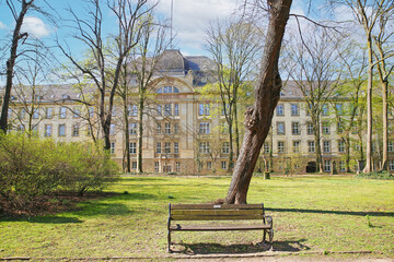 Düsseldorf (Golzheimer Friedhof), Germany - March 21. 2022: View over green park on ancient...