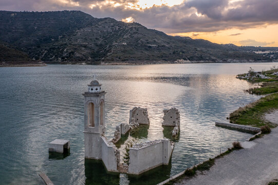 Ruined old church in Alassa, Cyprus is submerged under water of Kouris dam, photographed from drone