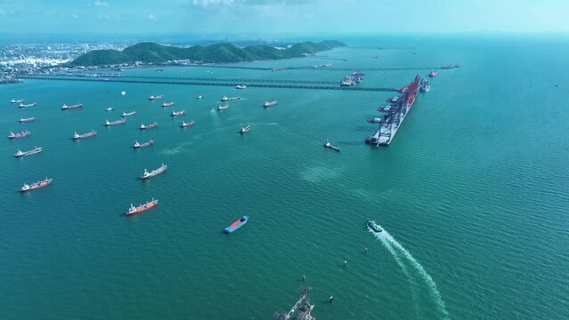 tug boat running near cargo ship at cargo crane on the bridge concept transportation logistic international import export and fright shipping marina