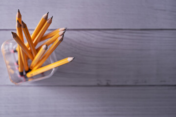 pen holder with yellow pencils