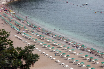 View of the chaise lounges in the rows on the beach in Budva, Montenegro