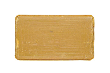 Piece of craft soap, brown in color. On a white background, close-up top view