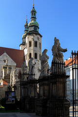 Statues of 12 apostles and Saint Andrew Church against blue sky on a sunny day in Krakow, Poland