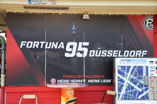 Düsseldorf, Germany - March 21.2022: View on wall of vintage traditional drink kiosk, meeting point for fortuna 95 soccer team fans with bar table, cigarette machine
