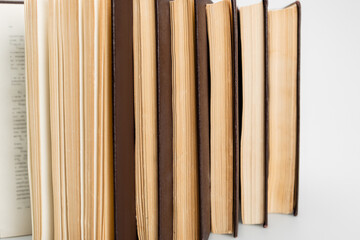 close up view of several paper books on grey background.