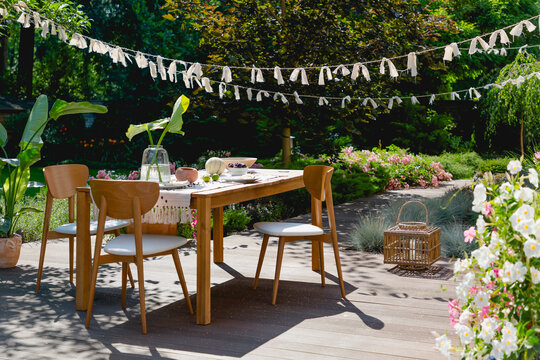 Wooden and rattan decorations in a summer garden
