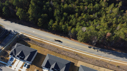 Aerial view of identical houses on a curved street in a residential area, Garner, North Carolina