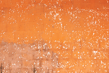 Beautiful old orange texture wall with white rustic dots