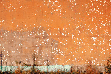 Beautiful old orange texture wall with white rustic dots